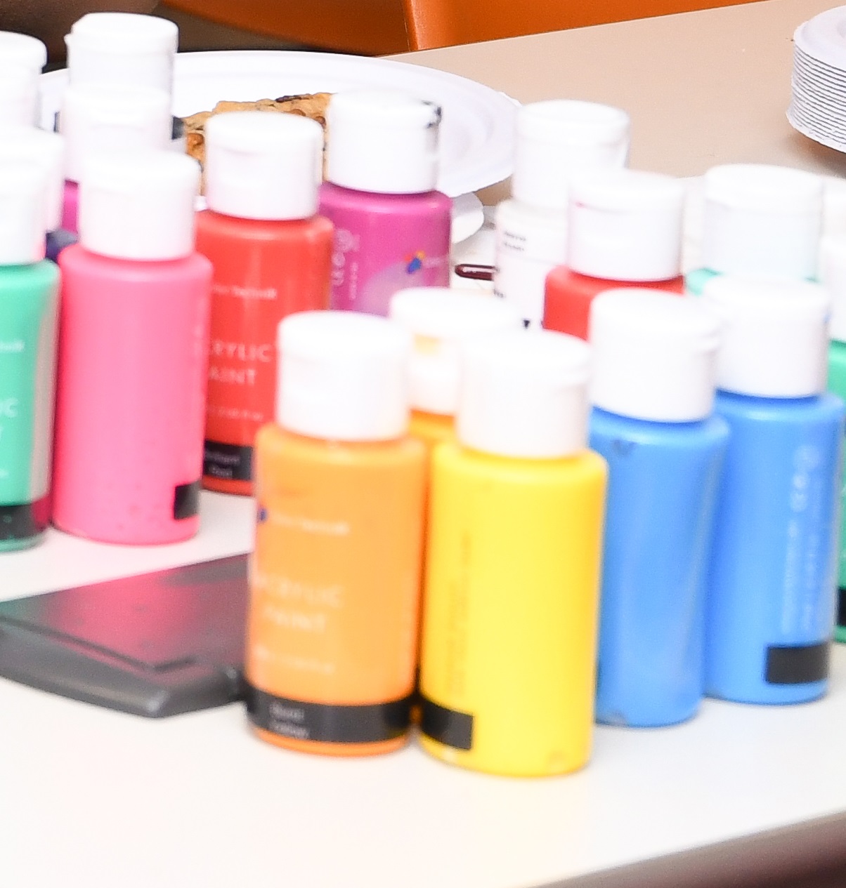 Small bottles of paint in various colors